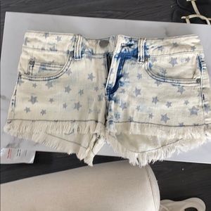 Star fringed jean shorts